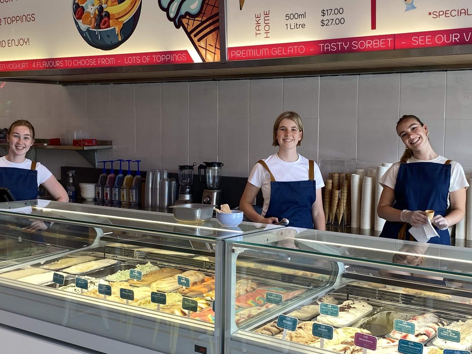 Three of the Sandy Scoops team behind the gelato cabinet