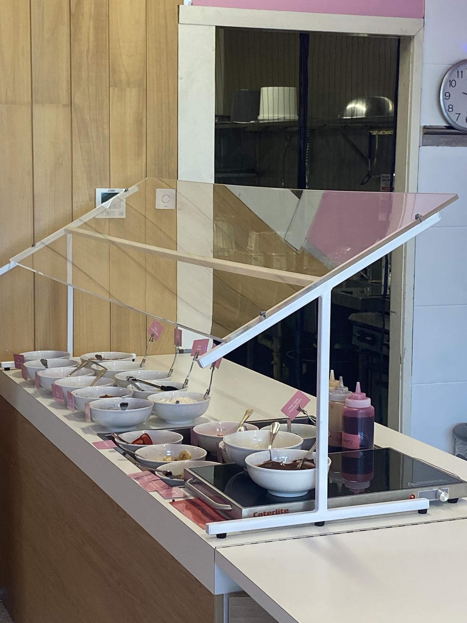 The frozen yoghurt toppings bar and cabinet